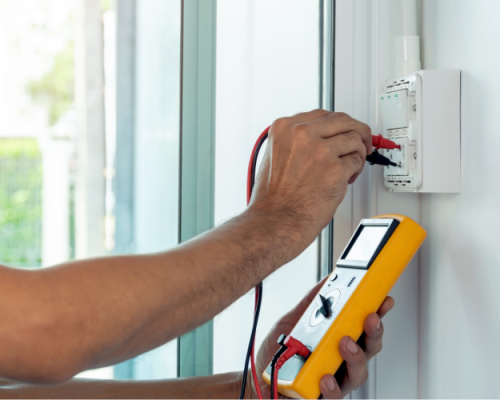 Professional electrician working on electrical installation services.